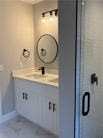 Bathroom featuring vanity and walk in shower