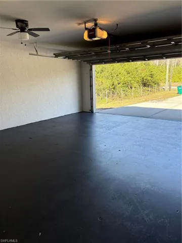 Garage featuring a garage door opener