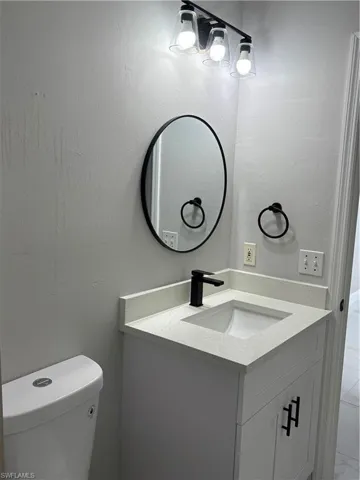Bathroom with vanity and toilet