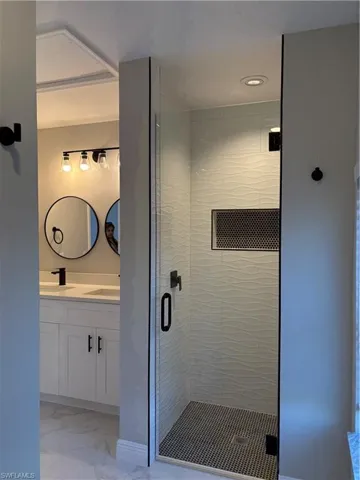 Bathroom with vanity and an enclosed shower