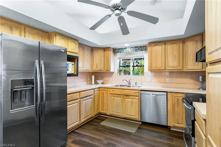 The spacious kitchen has stainless appliances, plenty of cabinet space and a floor-to-soffit pantry. The ceiling vaults up toward the great room, allowing more light in and the sense of even more space. The soffits are open above, meaning no load-bearing walls to worry about, if you want to open up the space to the great room.