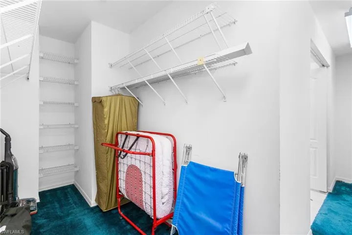 Wow! The second-floor primary suite has a an even bigger walk-in closet, including even more "wrap around" space for more storage or work/play space.