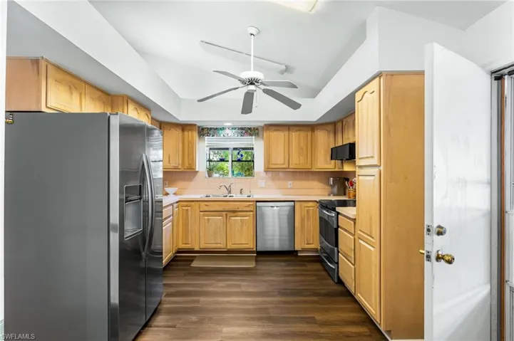 The spacious kitchen has stainless appliances, plenty of cabinet space and a floor-to-soffit pantry. The ceiling vaults up toward the great room, allowing more light in and the sense of even more space. The soffits are open above, meaning no load-bearing walls to worry about, if you want to open up the space to the great room.