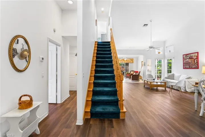 Stairway creates a quieting divide between the great room and the guest suite and laundry.