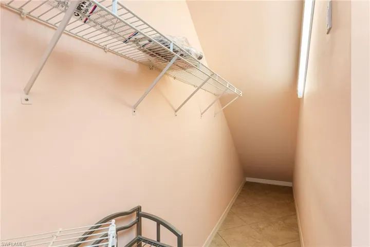 The first-floor primary suite has a huge walk-in closet, including "wrap around" space under the stairs for extra storage.