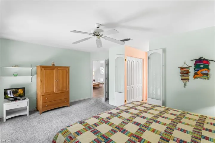 The first-floor primary suite has room for a king bedroom set plus sitting area, and has direct access to the screened lanai.