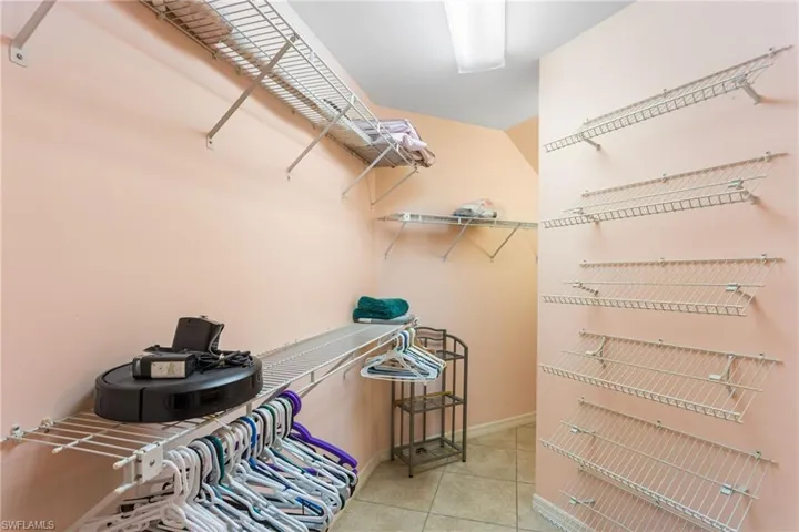 The first-floor primary suite has a huge walk-in closet, including "wrap around" space under the stairs for extra storage.