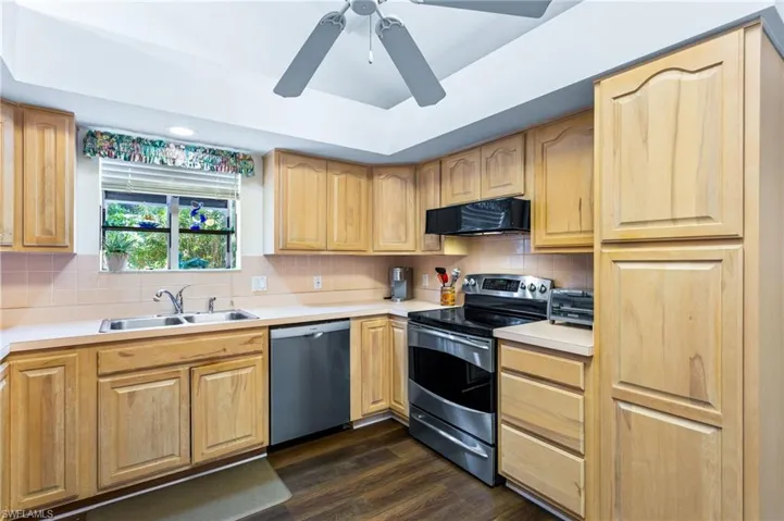 The spacious kitchen has stainless appliances, plenty of cabinet space and a floor-to-soffit pantry. The ceiling vaults up toward the great room, allowing more light in and the sense of even more space. The soffits are open above, meaning no load-bearing walls to worry about, if you want to open up the space to the great room.