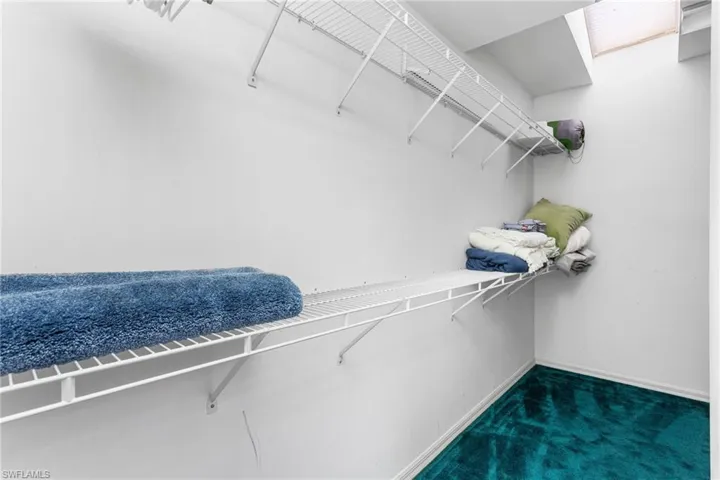 Wow! The second-floor primary suite has a an even bigger walk-in closet, including even more "wrap around" space for more storage, or or work/play space.
