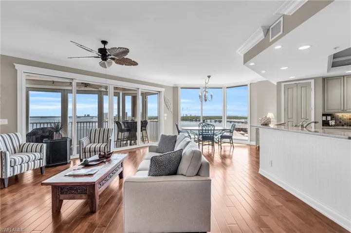 Living room with ceiling fan with the new hardwood flooring