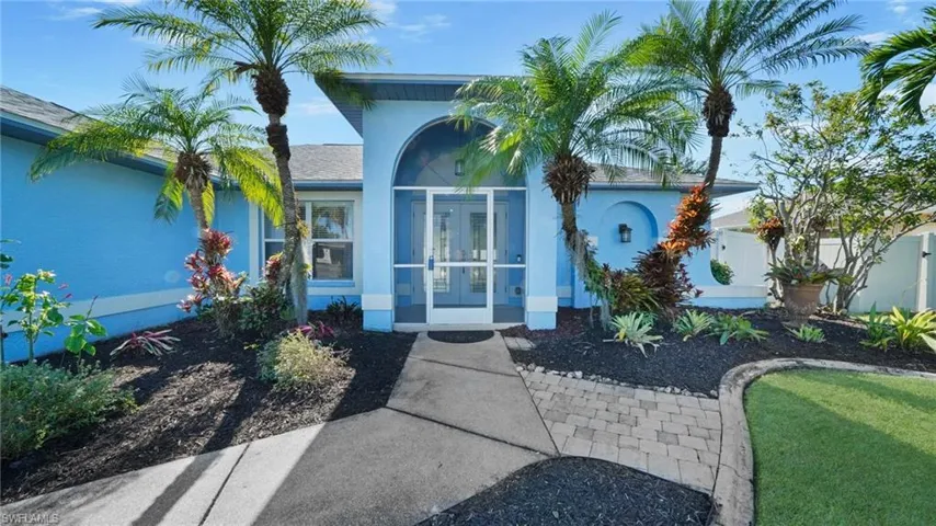 View of front of house with screened entry and french doors