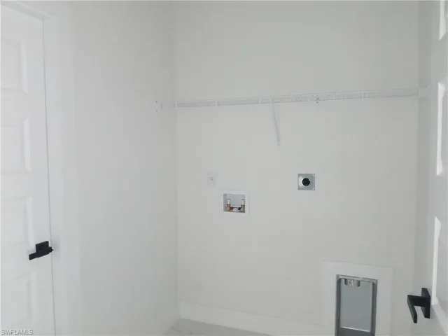 Washroom featuring electric dryer hookup and hookup for a washing machine