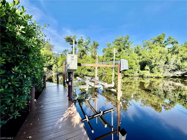 Dock featuring a water view and boat lift