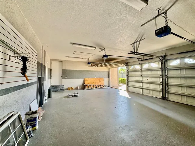 Garage featuring a garage door opener
