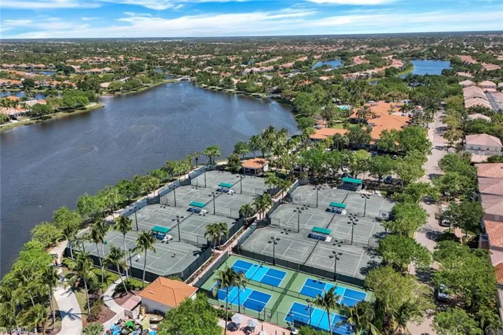 Community with multiple tennis courts, pickleball courts, and a waterside setting