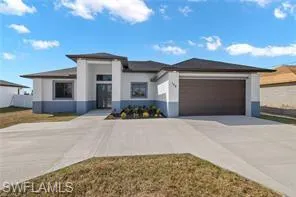 Prairie-style home featuring a garage