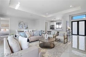 Living room featuring a tray ceiling