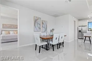 Dining area featuring light tile flooring