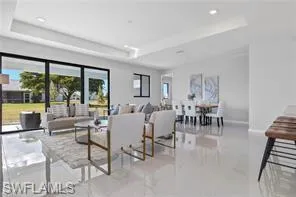 Tiled living room with a tray ceiling