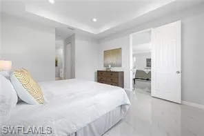 Bedroom featuring a raised ceiling