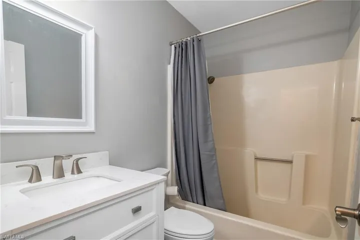 Guest bath with new vanity/sink and flooring.