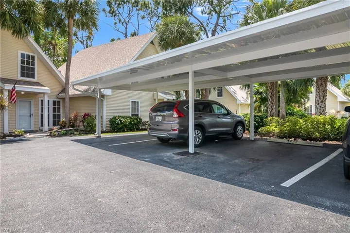 Covered parking space with brand new overhangs and lots of guest parking spaces.