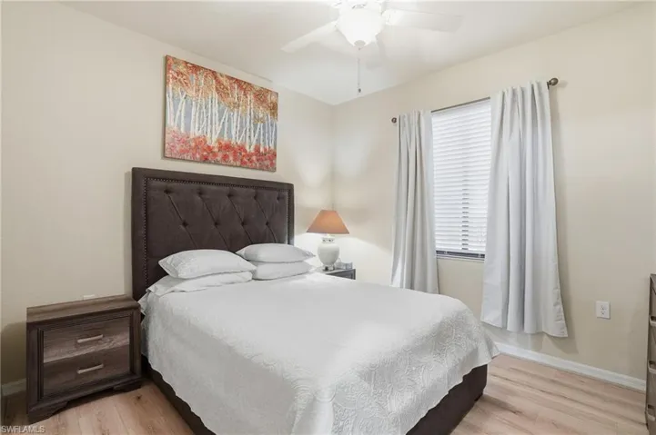 Bedroom featuring light wood-type flooring and a ceiling fan