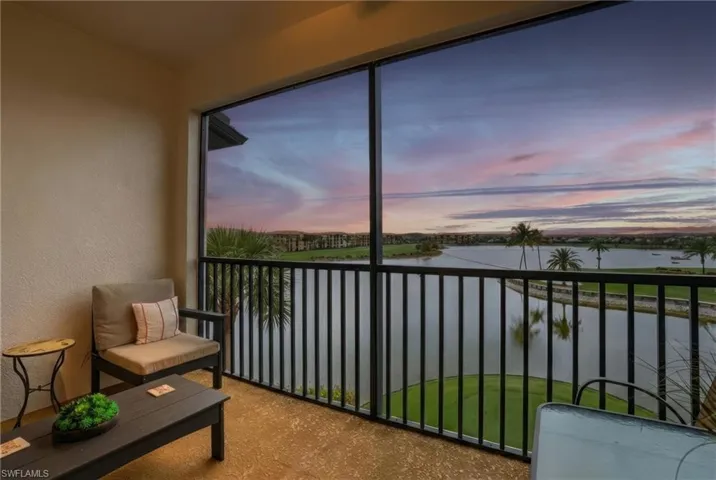 Sunroom / solarium with a water view