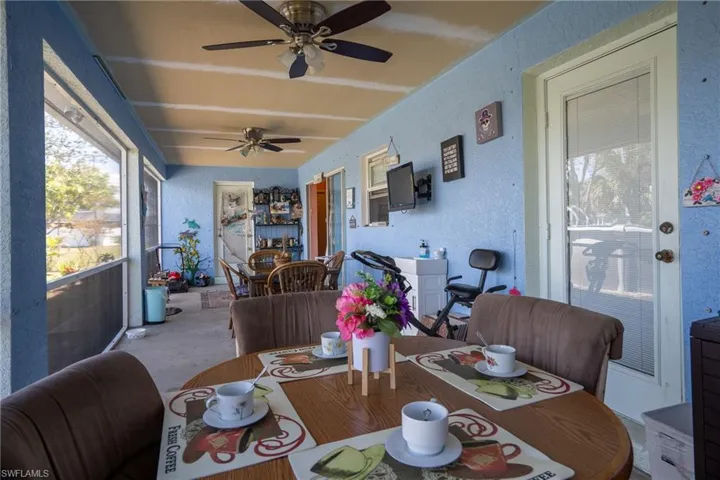 Sunroom with a ceiling fan