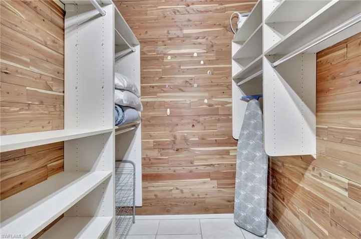 Spacious closet featuring light tile patterned floors