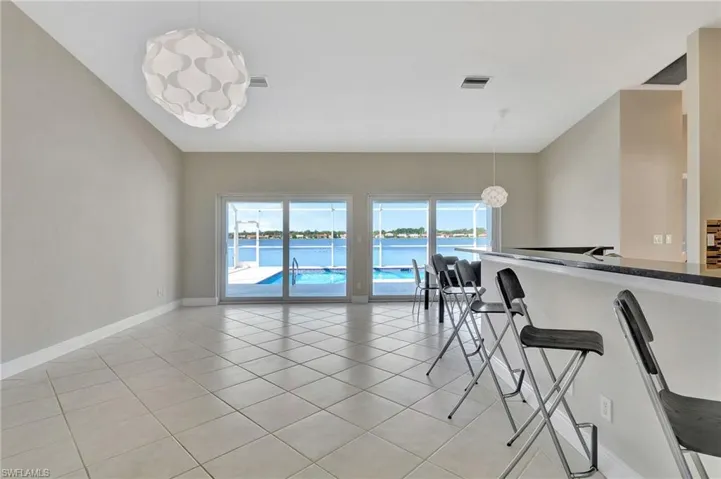 Tiled dining space with a water view
