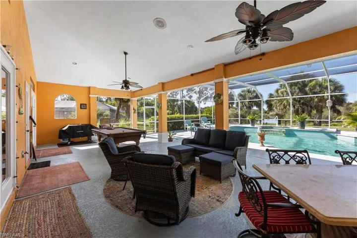 Sunroom / solarium featuring pool table and ceiling fan