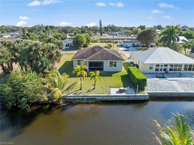 View from above of property with a nearby body of water