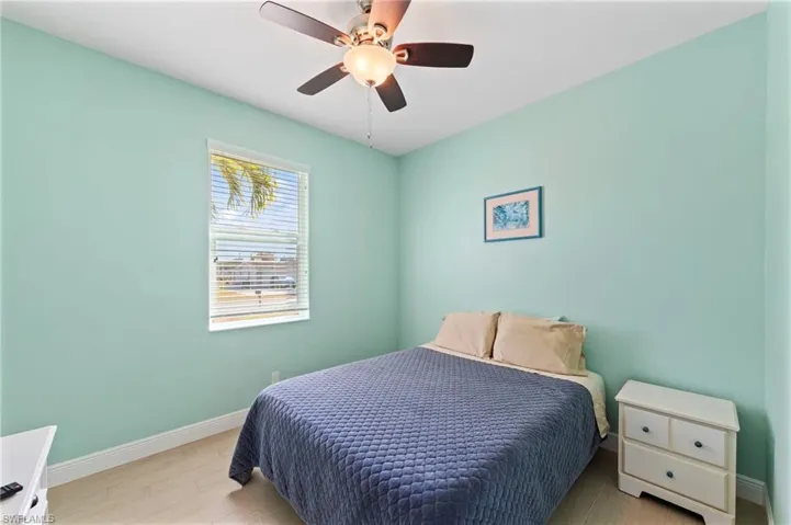 Bedroom featuring wood finished floors and ceiling fan