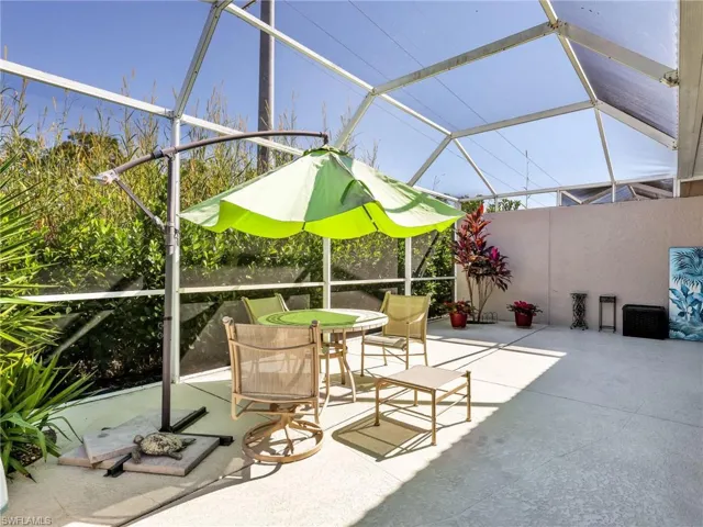 View of patio / terrace with glass enclosure and a sunroom