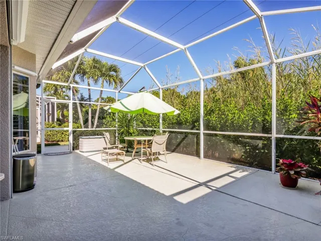 View of patio featuring a lanai and a sunroom