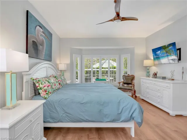 Bedroom featuring light wood-type flooring and ceiling fan
