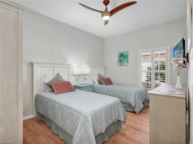 Bedroom featuring light wood-type flooring and a ceiling fan