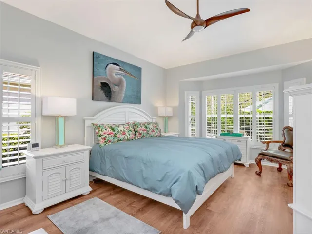 Bedroom with wood finished floors and ceiling fan