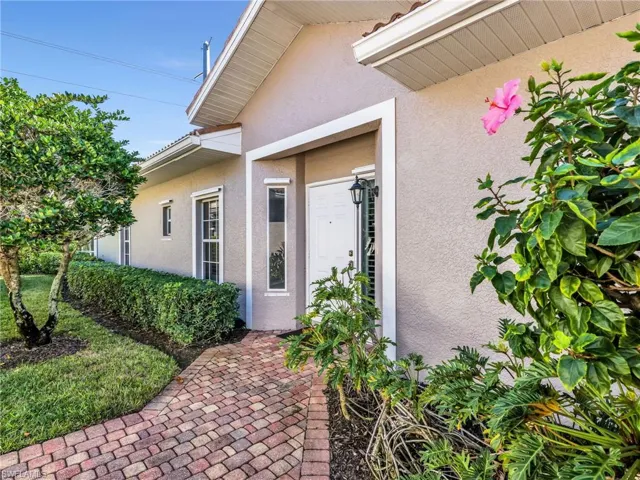 Property entrance featuring stucco siding