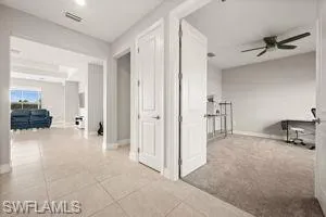 Hallway featuring baseboards