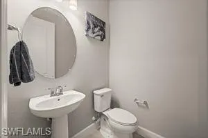 Half bathroom with baseboards