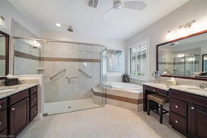 Bathroom featuring independent shower and bath, vanity, ceiling fan, and tile floors
