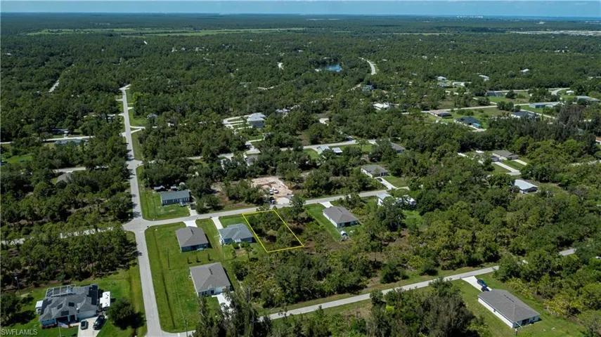 Aerial overview of property's location with a forest and property boundaries highlighted