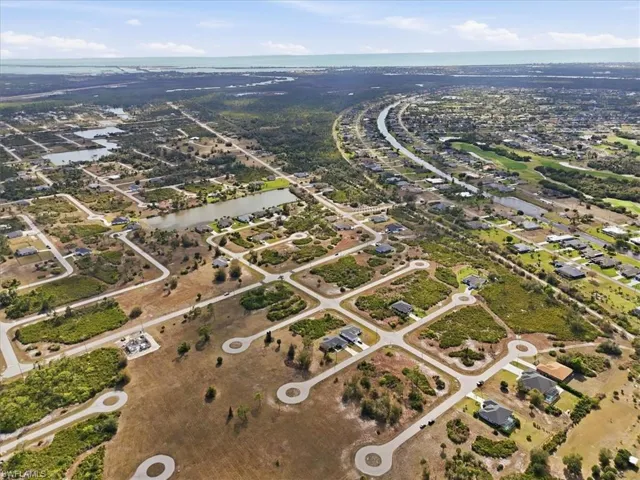 View of property location with nearby suburban area