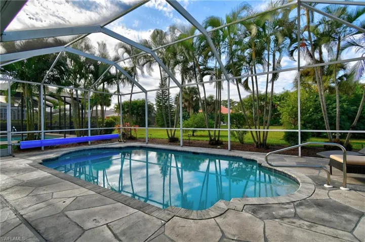 Stamped concrete surrounds the pool