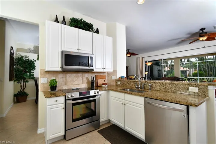 Convenient kitchen set up and overlooks pool and screened in lanai