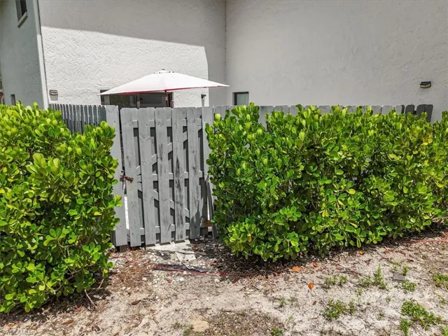 Exterior view of a gate and stucco siding