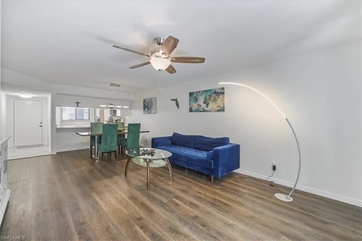 Living area featuring ceiling fan and wood finished floors