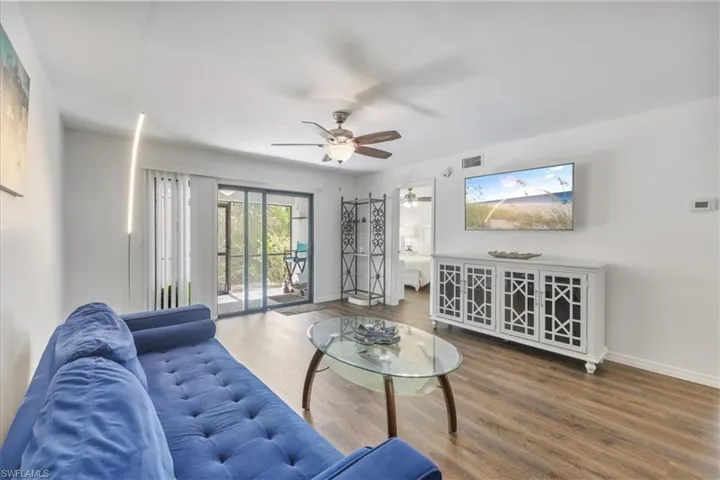 Living room featuring wood finished floors and ceiling fan